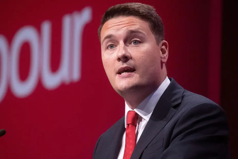 wes streeting speaking on stage