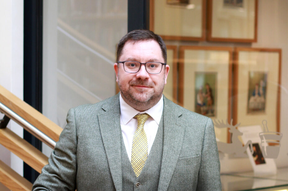 Photo of Jonathan Burton in front of a blurred background