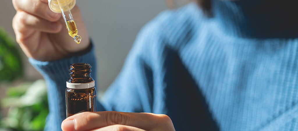 Woman using cannabis oil