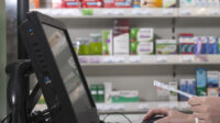 Pharmacist using computer