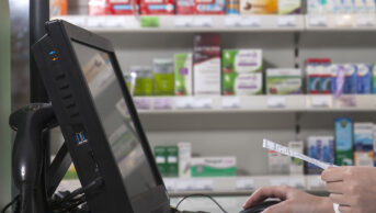 Pharmacist using computer