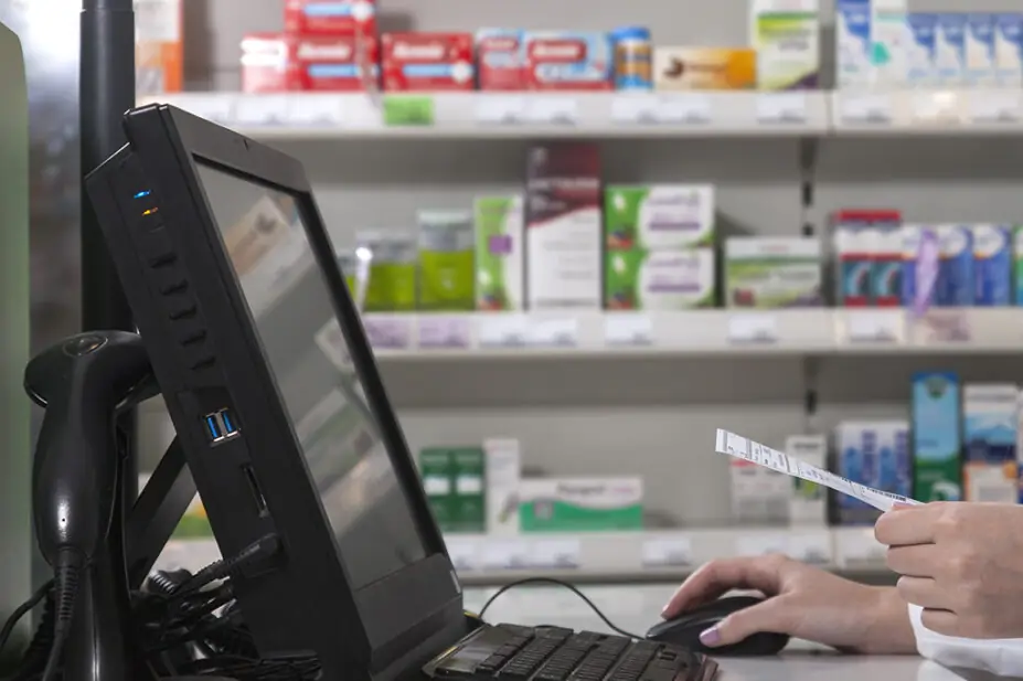 Pharmacist using computer