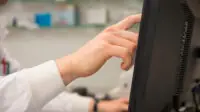 Pharmacist using computer