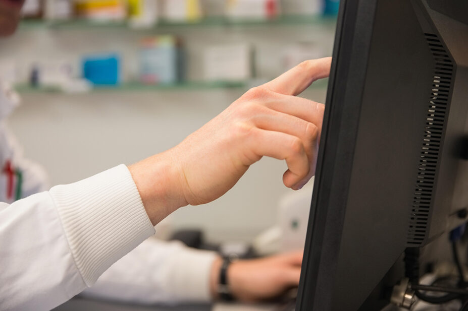 Pharmacist using computer