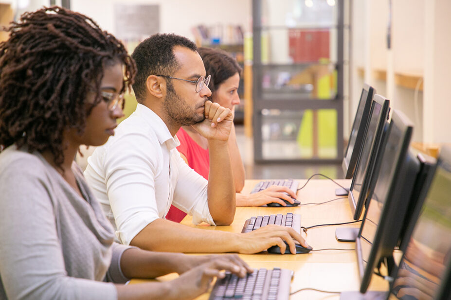 People undertaking assessment on computers