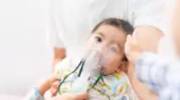 Young boy with nebuliser