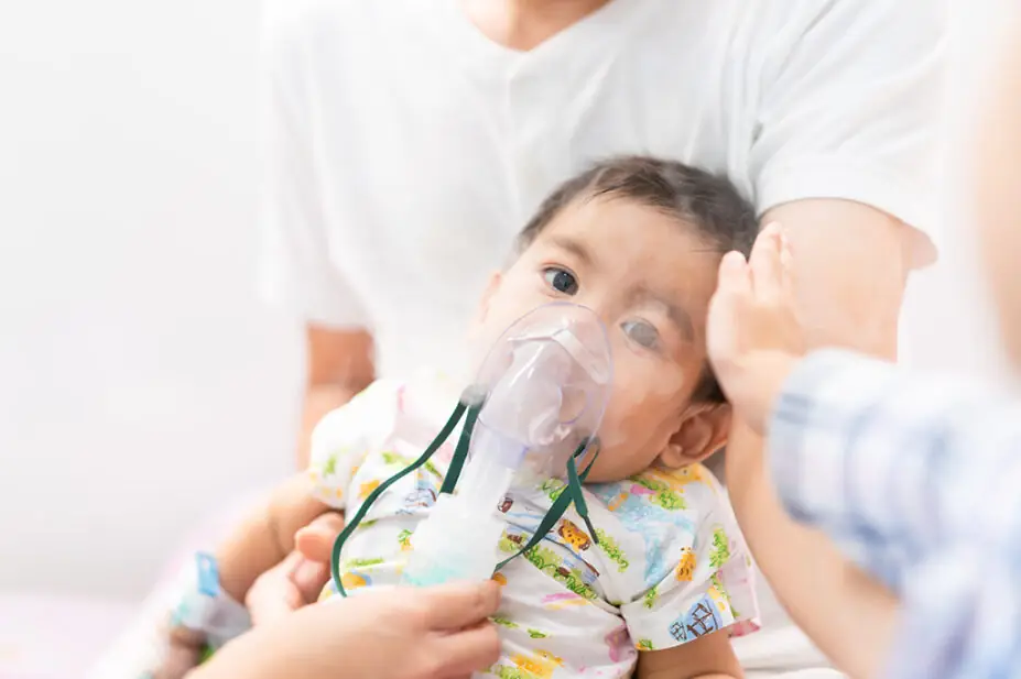 Young boy with nebuliser