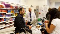 People buying medicines from UK pharmacy counter