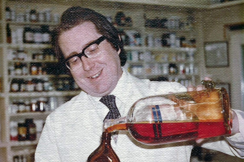 Photo of a younger Francis Michael Judge, in a chemist dispensary