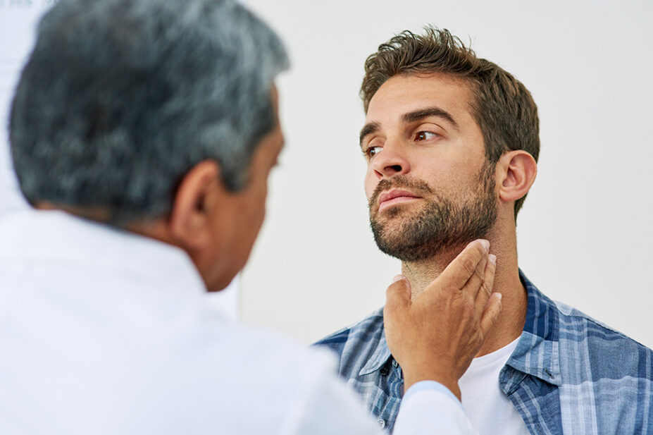 Clinician checking a person's neck