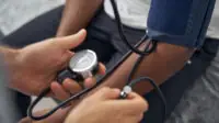 Patient gets blood pressure taken.