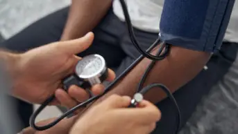 Patient gets blood pressure taken.