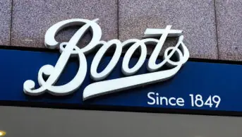 Boots signage above shop door