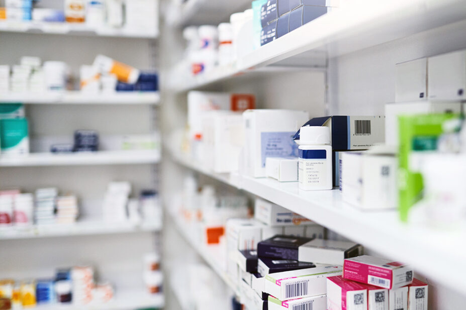 Pharmacy shelf with medicine boxes and packets