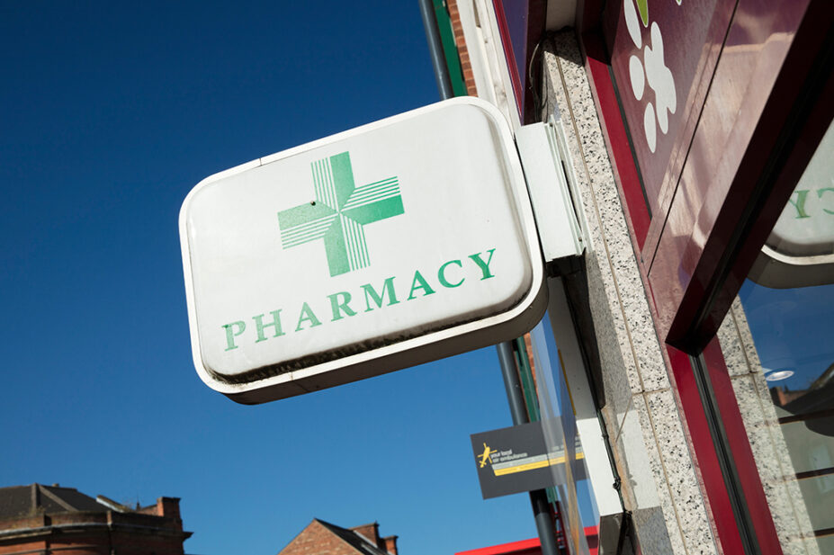 Phamacy sign on exterior of community pharmacy building