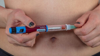 Woman holding Victoza injection pen