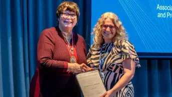 Joanne Brown accepts Barnett Award from Claire Anderson, president of the RPS