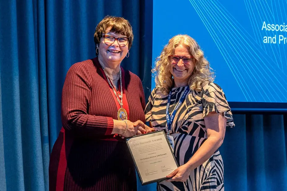 Joanne Brown accepts Barnett Award from Claire Anderson, president of the RPS