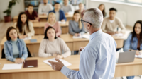 Professor conducts a lecture to university students