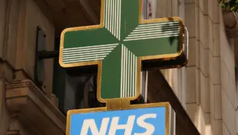 NHS pharmacy sign in street, London