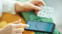 A woman ordering medicines via an online pharmacy