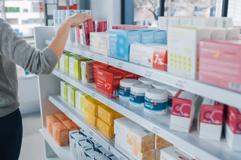 Customer browses medicines in a pharmacy