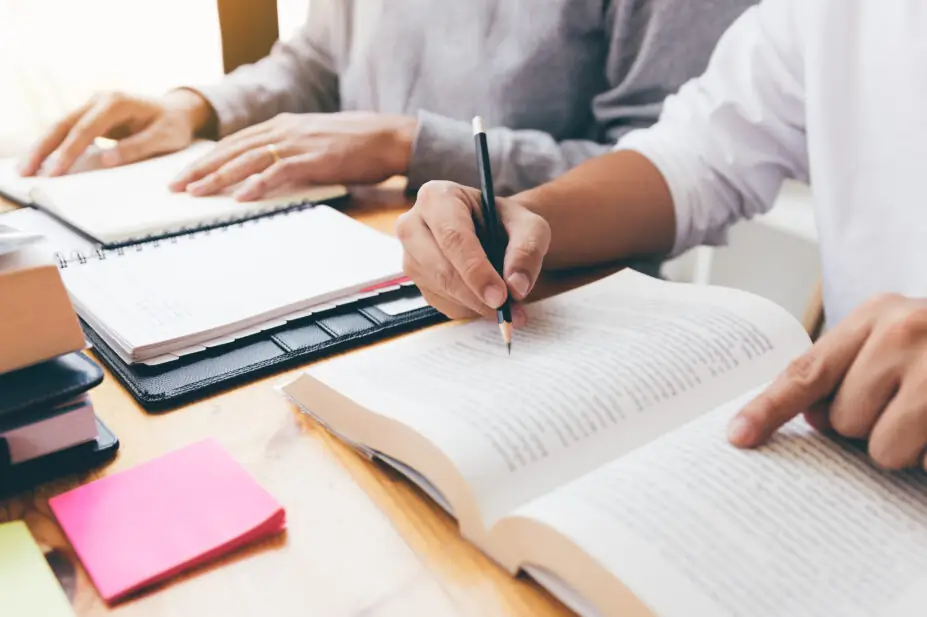 University students study from textbooks