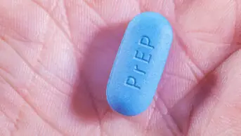 PrEP pill in the palm of a person's hand