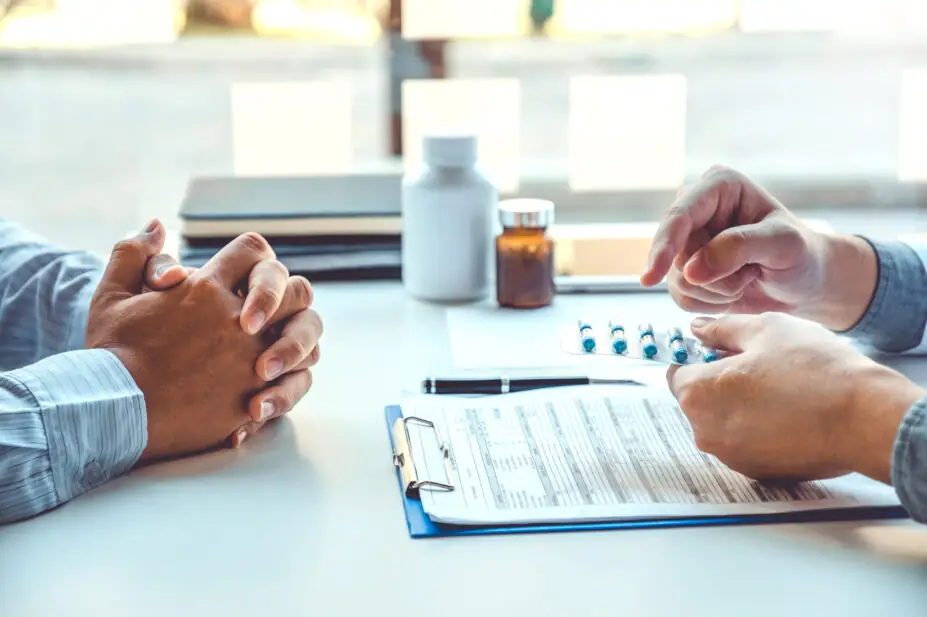 Healthcare professional prescribes medicine to patient