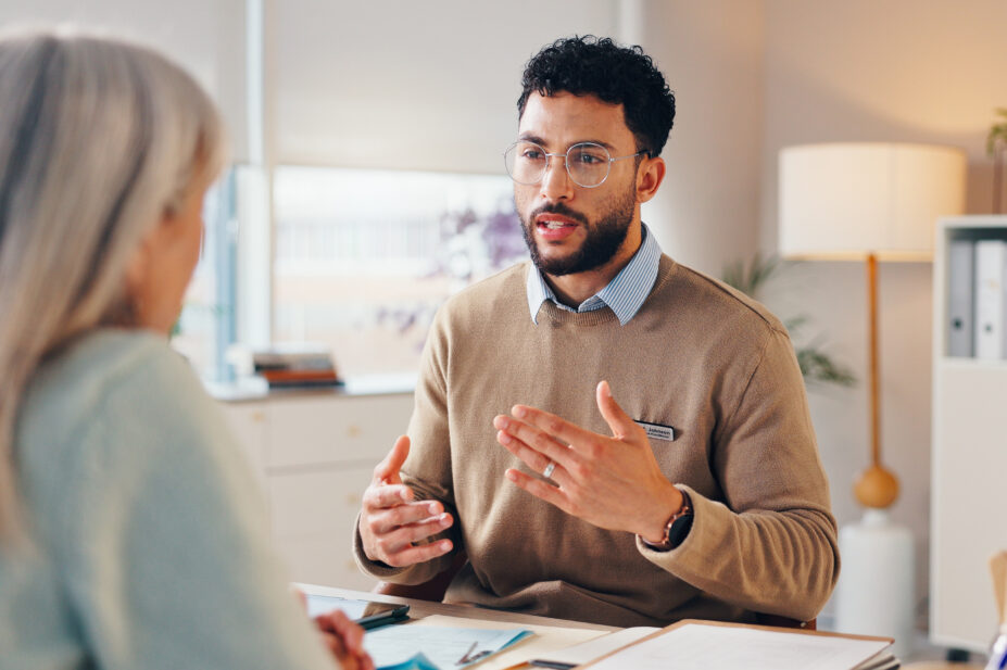 Healthcare professional conducts consultation with patient