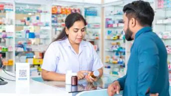 Pharmacist consults with patient