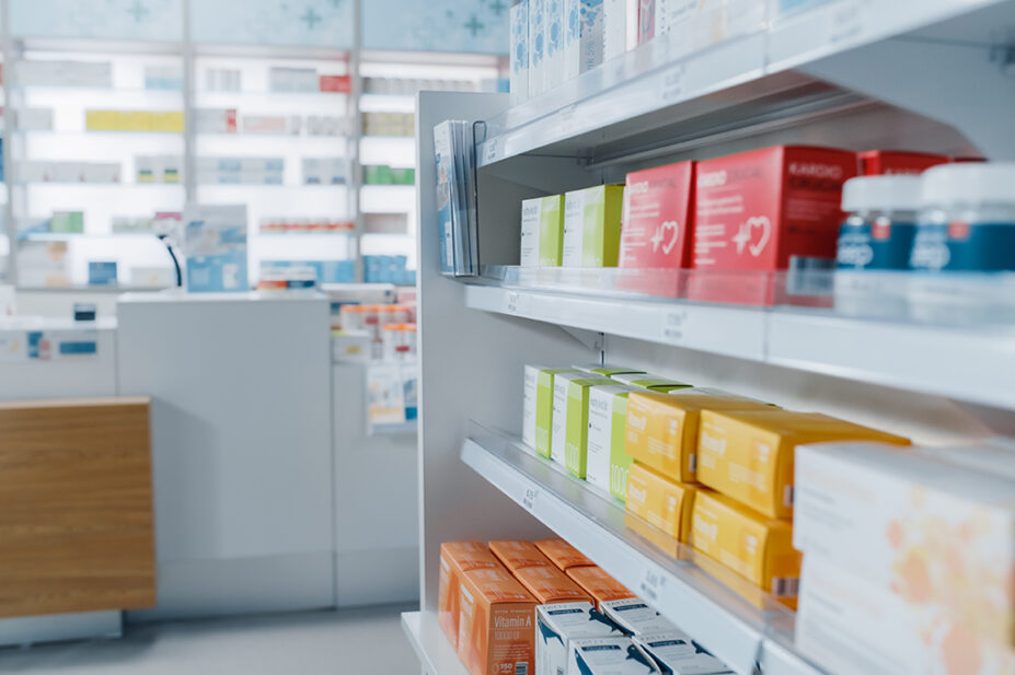 The stocked shelves of a community pharmacy