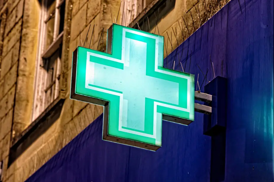 The pharmacy sign outside of a Boots chemist