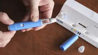 A person prepares a semaglutide injection