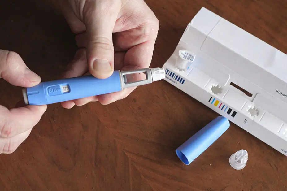 A person prepares a semaglutide injection