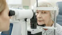 Healthcare professional conducts eye exam