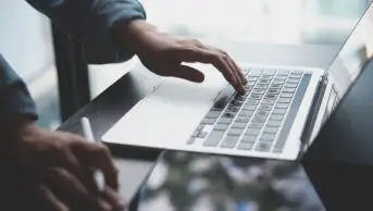 A person using a laptop computer