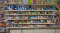 Pharmacy shelves in UK pharmacy