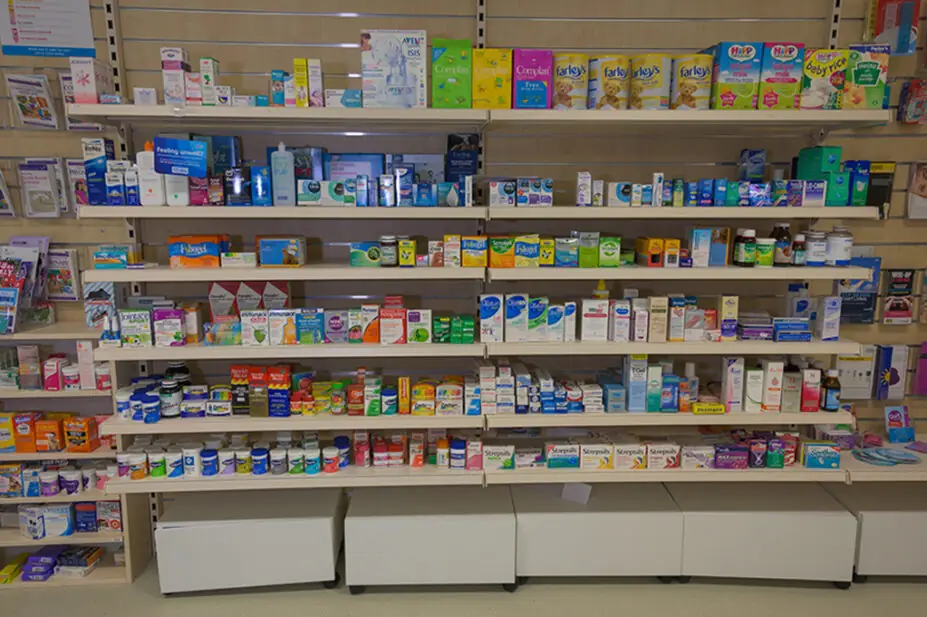 Pharmacy shelves in UK pharmacy