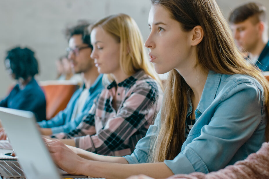 Students listen to a university lecture