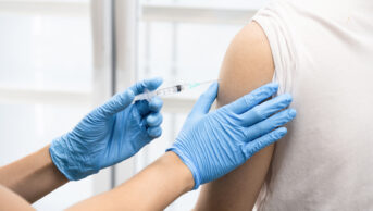 A patient receives an injection.