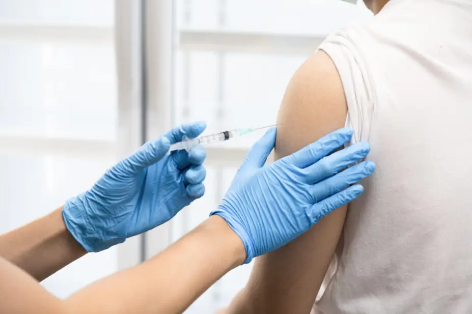 A patient receives an injection.