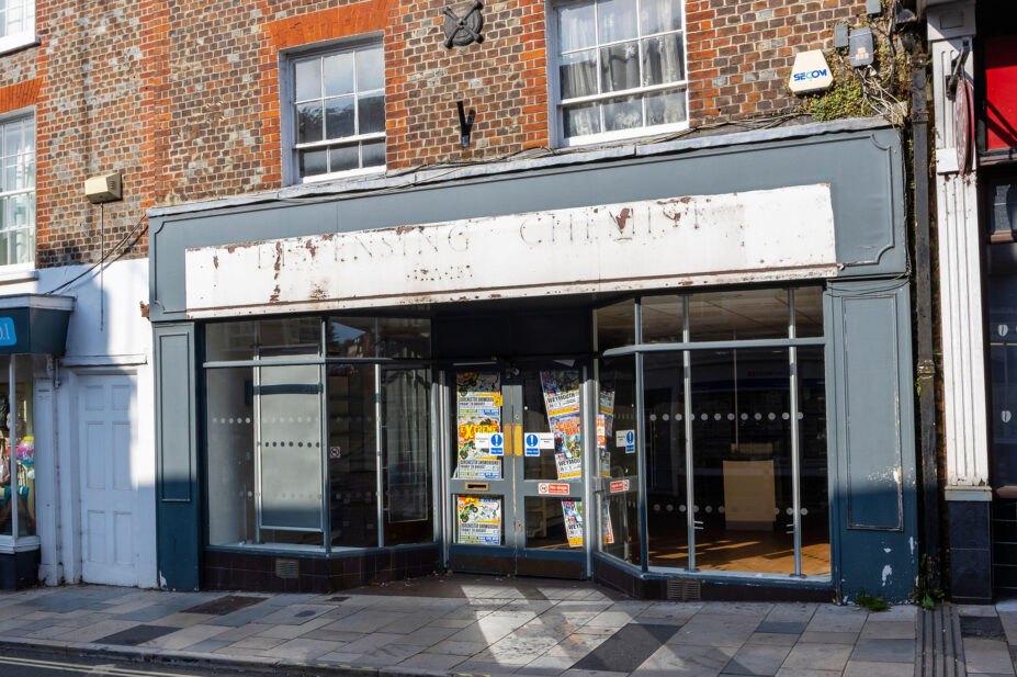 Empty unlet pharmacy shop unit in Salisbury Street, Blandford Forum town centre, a traditional market town in North Dorset, south-west England
