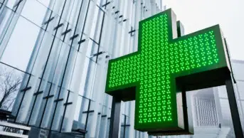 The green cross pharmacy sign