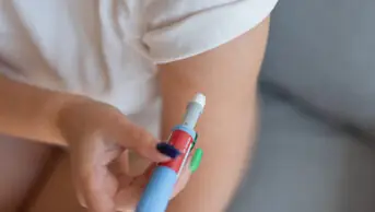 Woman uses a weight-loss pen