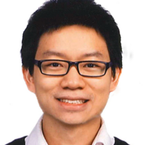 Andrew smiles wearing glasses in front of white background