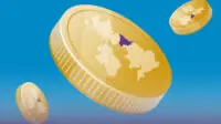 3 Gold coins each with map of UK on the side, highlighting the North of England/Cumbria region