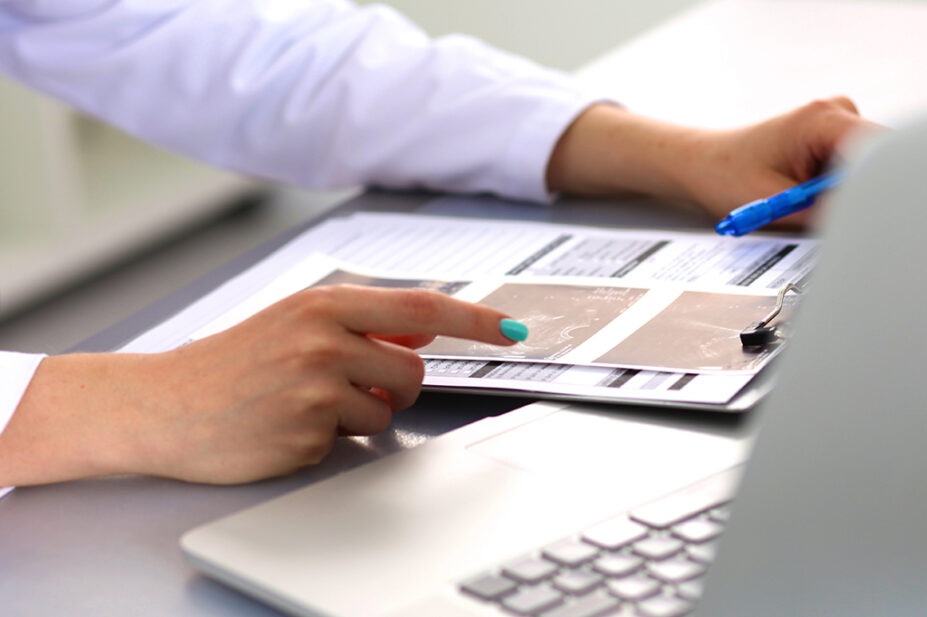 A healthcare professional using a computer