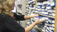 A pharmacist organises prescriptions