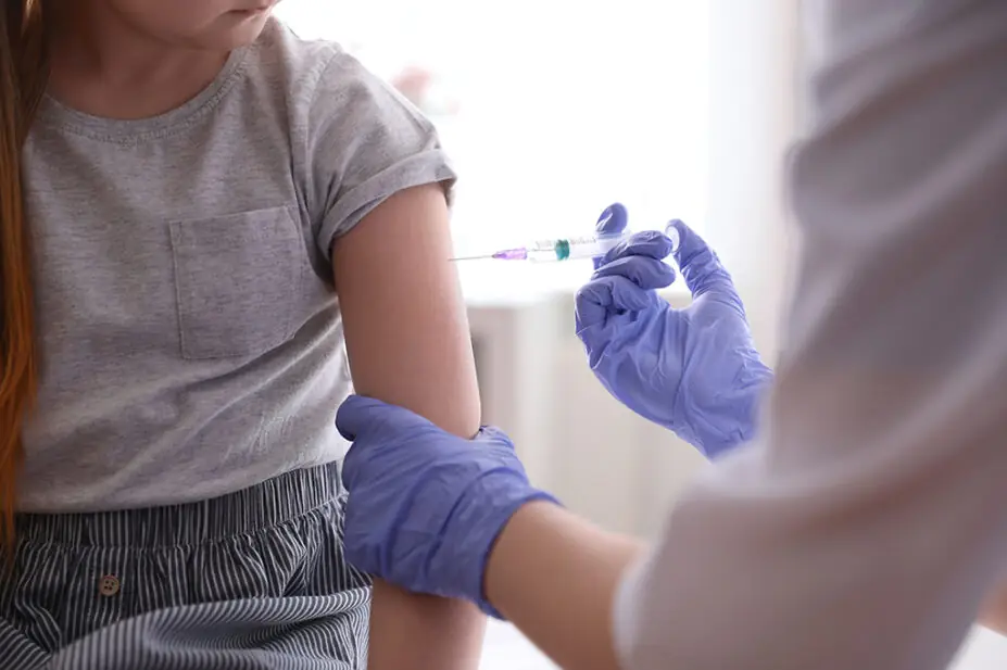 A child receives a chickenpox vaccine